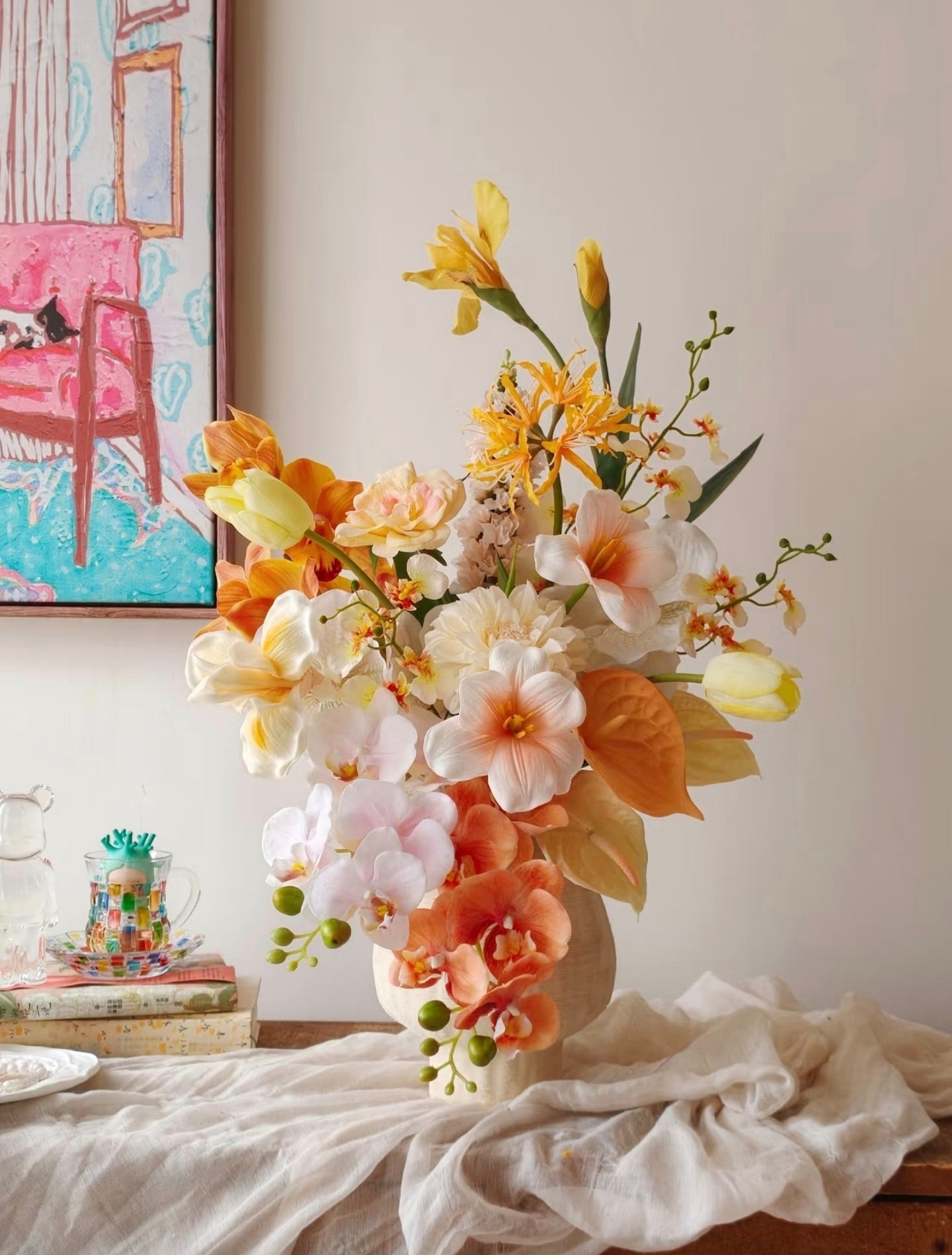 Golden Hour bouquet - close up of peach orchids, orange anthurium leaves and cream dahlias