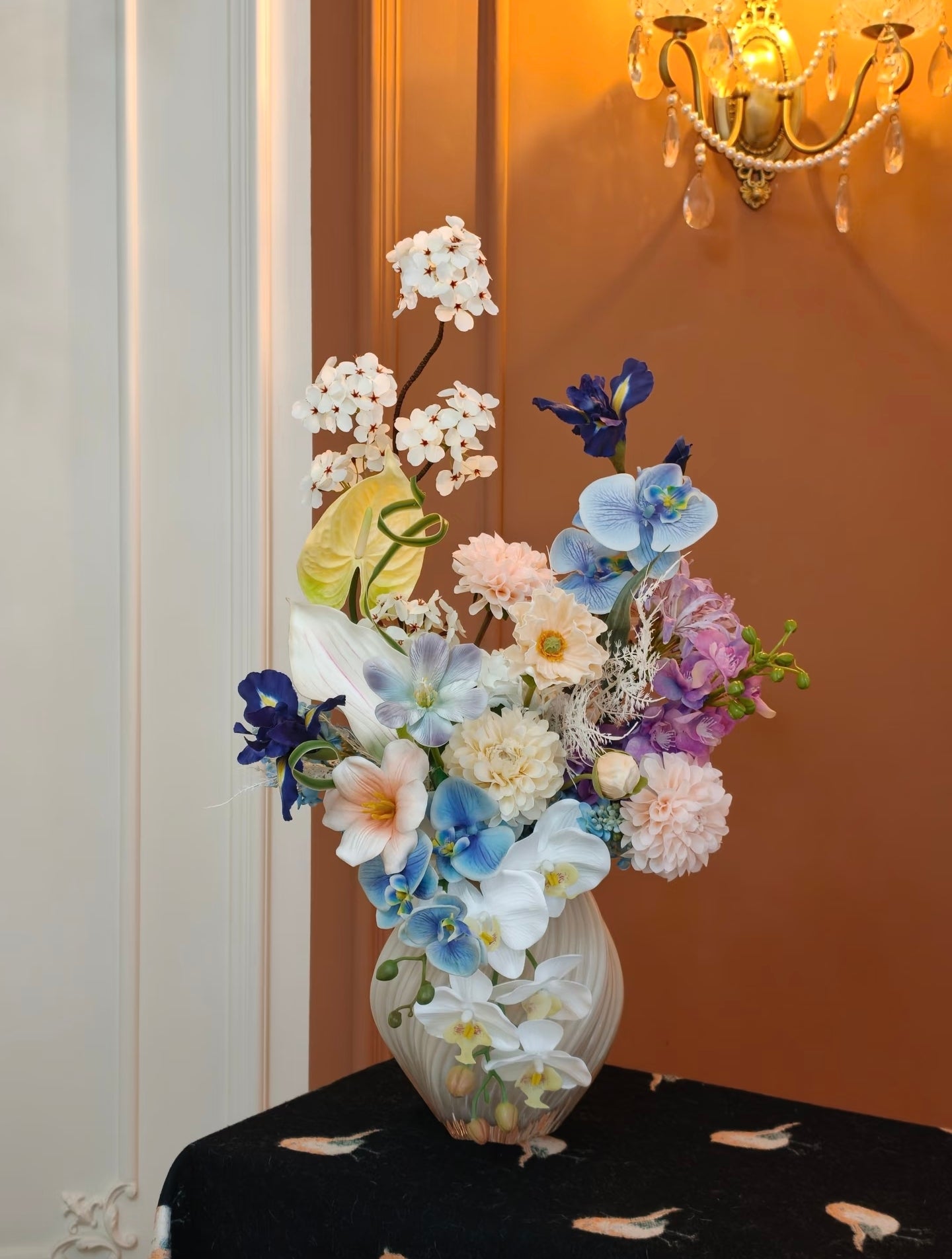 Luxury faux flower bouquet styled in warm interior setting