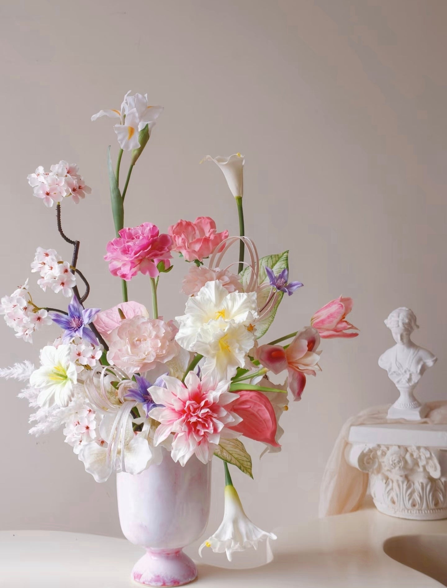 Blush garden faux flower bouquet styled with art print background