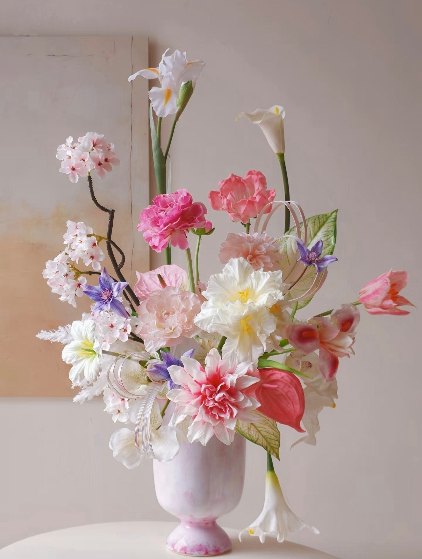 Blush garden faux flower bouquet with classical sculpture backdrop
