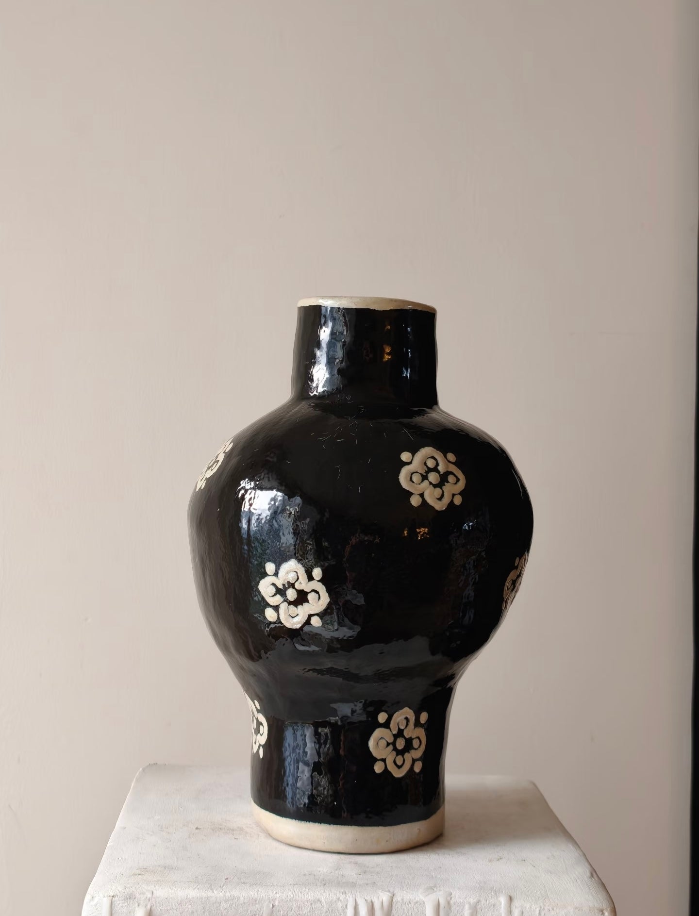 Hand-glazed black ceramic vase with ivory plum blossom motif - standalone