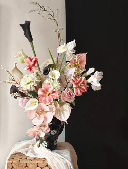 Ink & Petal bouquet against black and white split background
