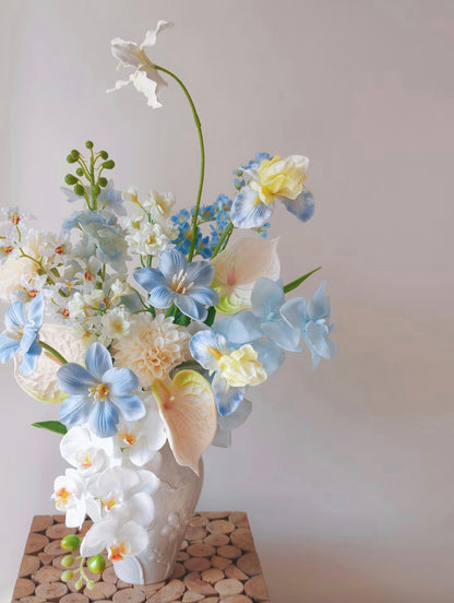 Cloud & Petal bouquet in sculptural ivory ceramic vase - front view on linen cloth