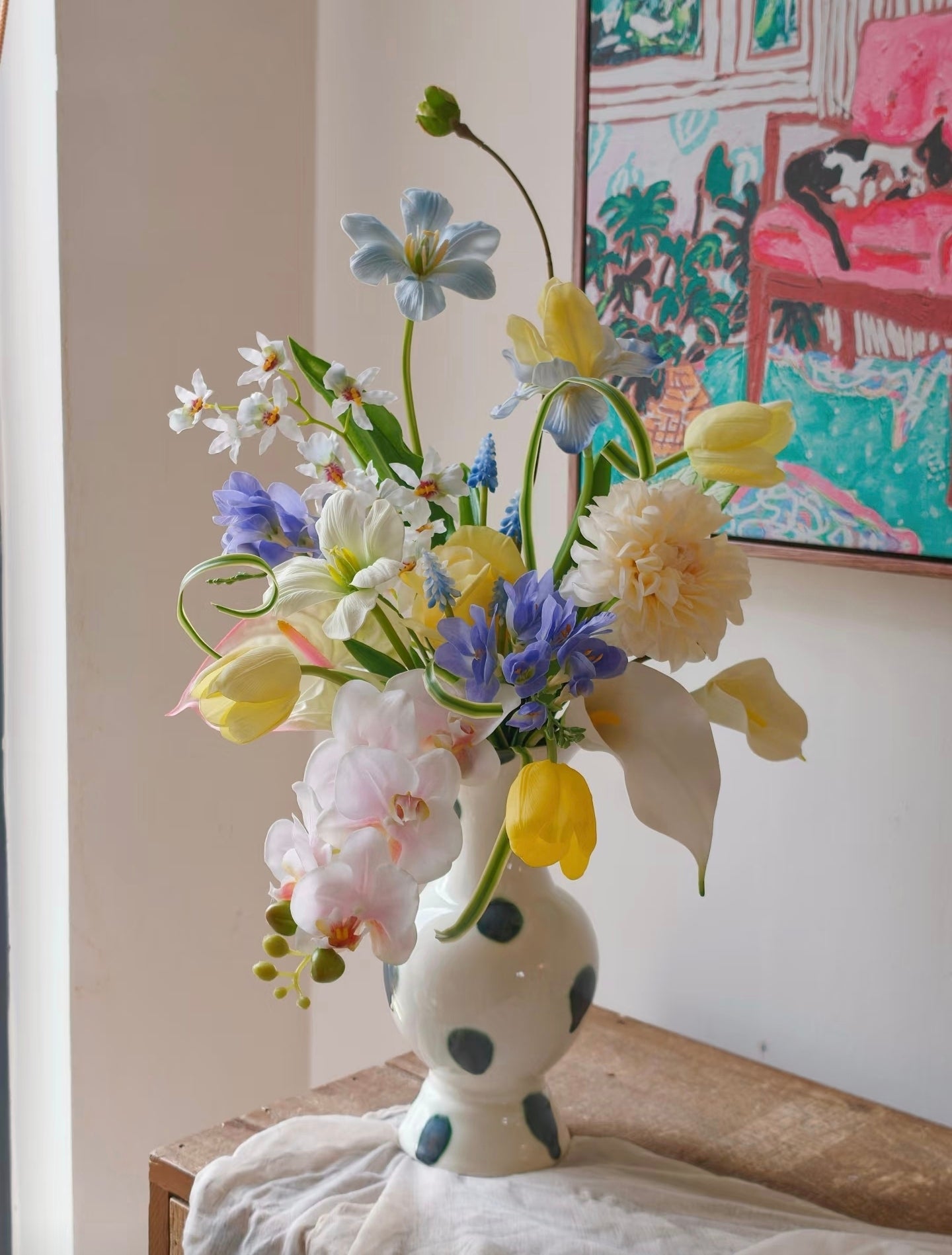 The Painter's Garden bouquet - full arrangement with art print backdrop, bright light