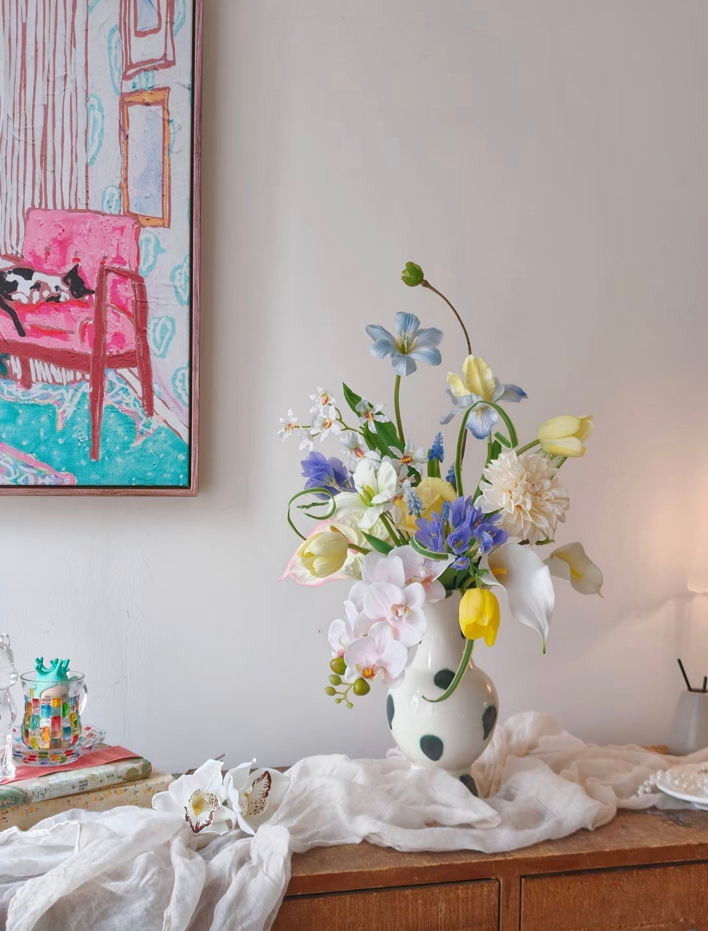 The Painter's Garden bouquet - close up of yellow tulips, blue clematis and blush orchids