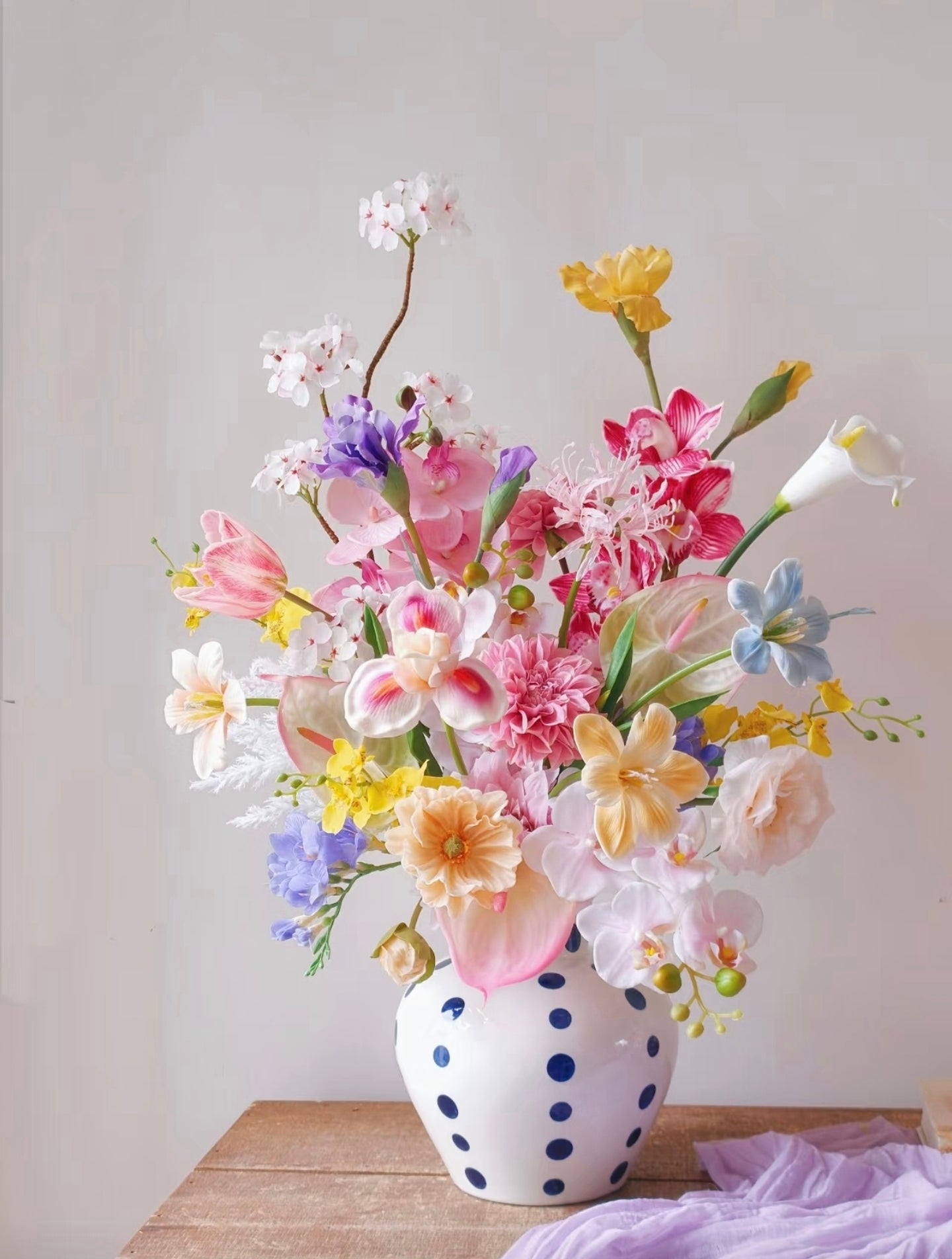 The Grand Garden bouquet styled with colourful art print backdrop - full arrangement