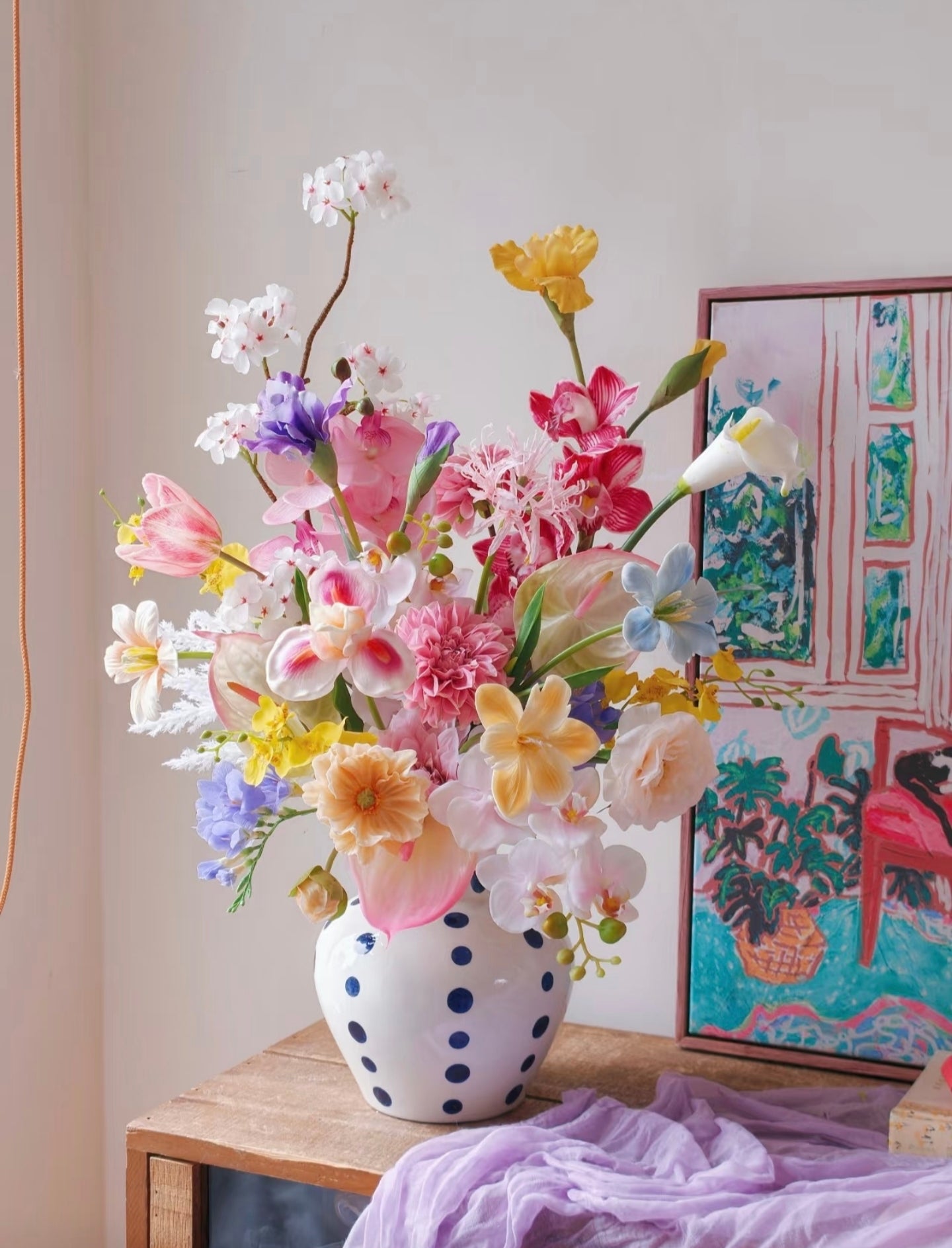The Grand Garden bouquet on wooden table with lavender cloth - full arrangement