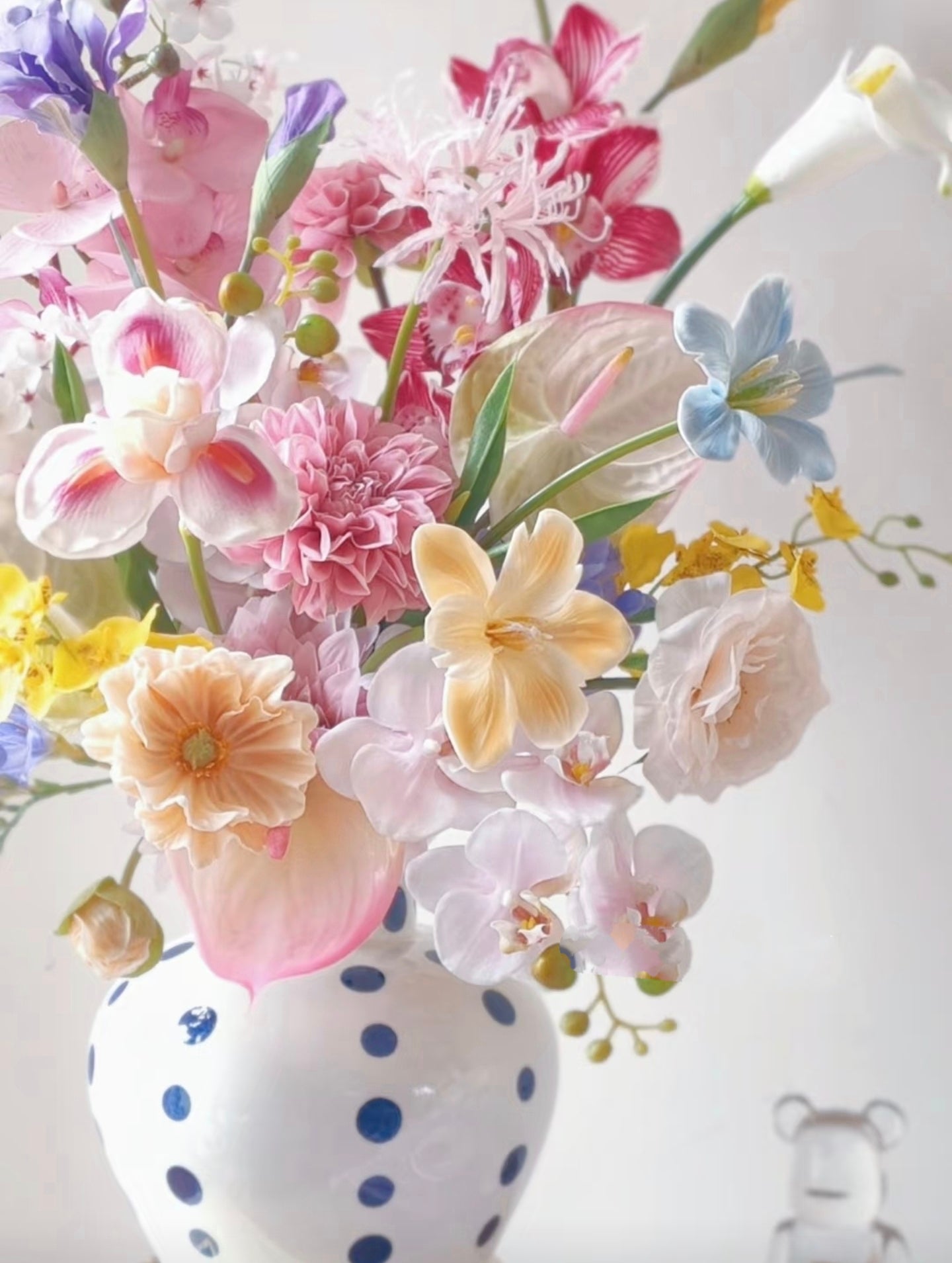 Polka dot vase dimensions - hand-glazed white ceramic with navy dots, 21cm height, 11cm opening