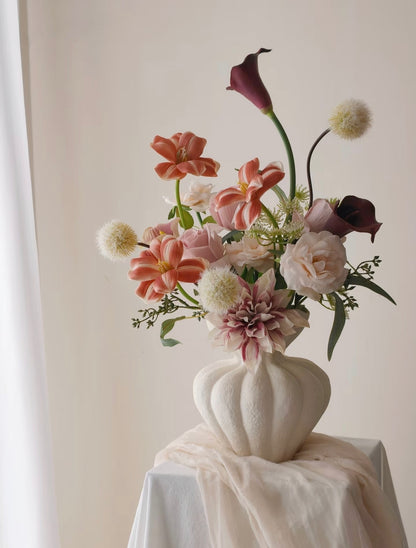 Dusk & Dahlia bouquet - side angle showing burgundy calla lily arch and coral tulips