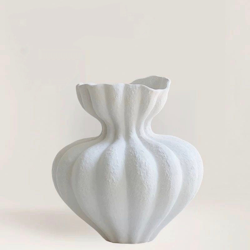Porcelain Dream bouquet in sculptural white ceramic vase - front view on wooden cabinet