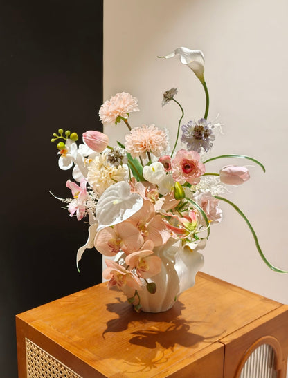 Sculptural matte white ceramic vase with ruffled petal-edge rim - standalone product shot