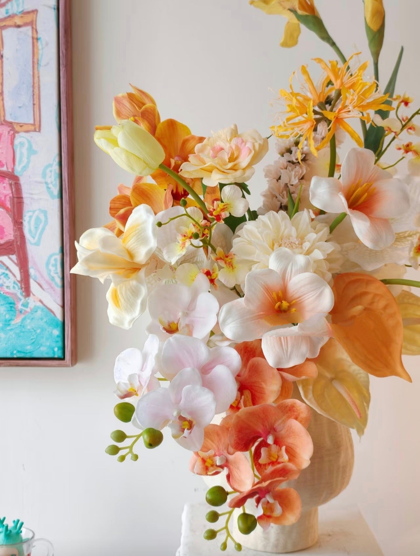 Golden Hour bouquet styled with colourful art print backdrop - full arrangement